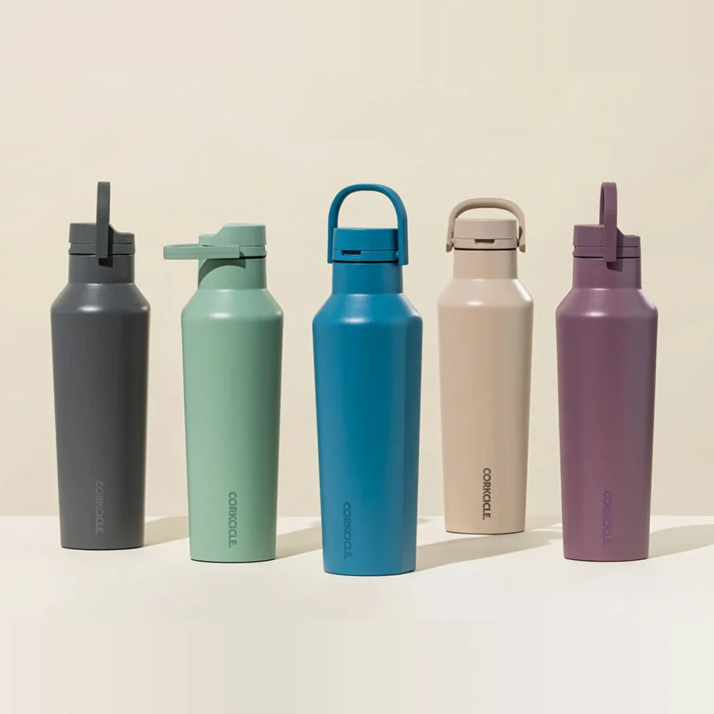 5 corkcicle water bottles against a beige background